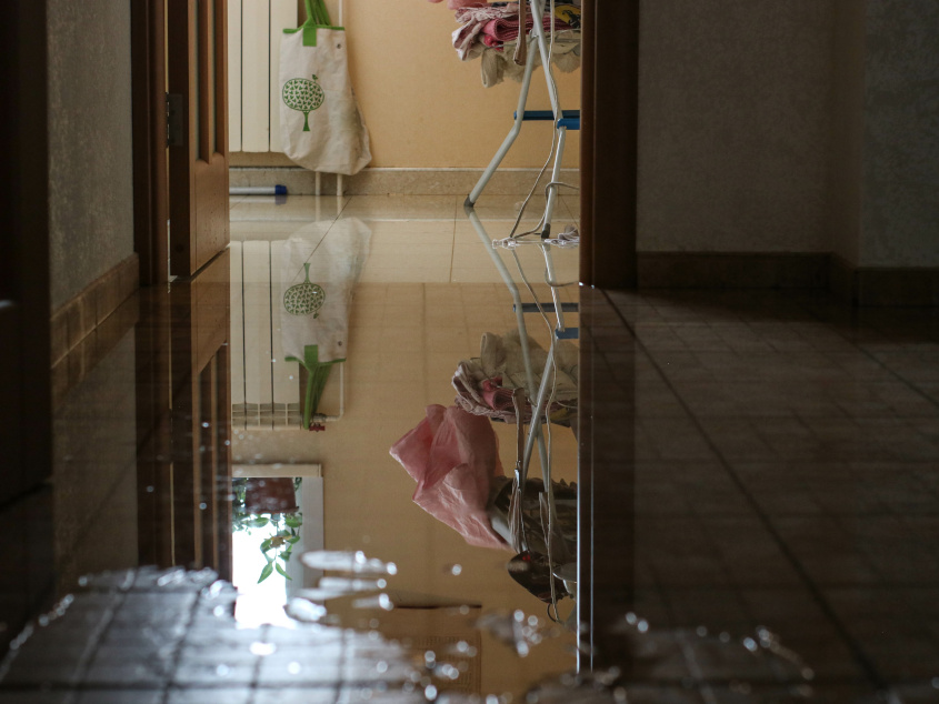 Water damage from broken pipe - wet floor
